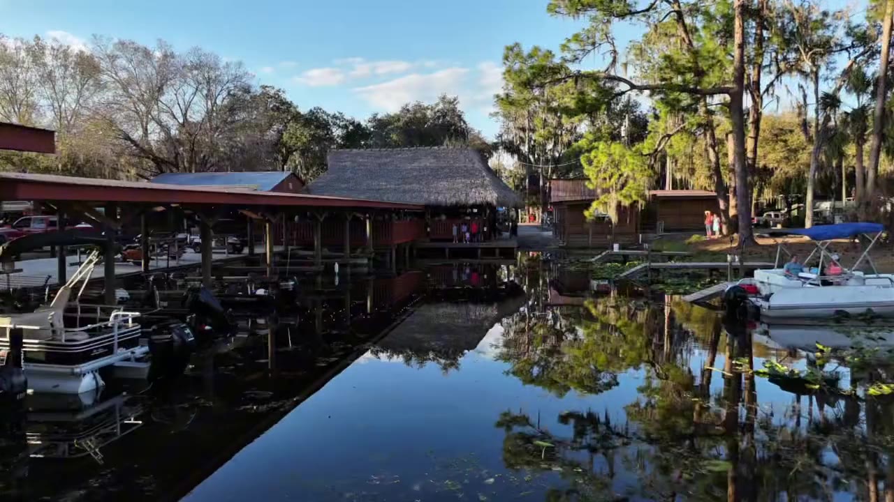 The canal at Cherry Pocket, with boats tied up under the trees