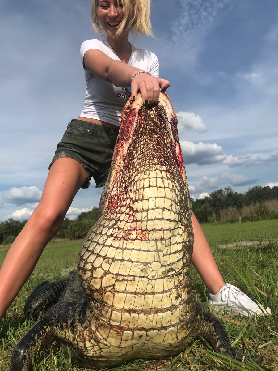 Hunter with a harvested alligator