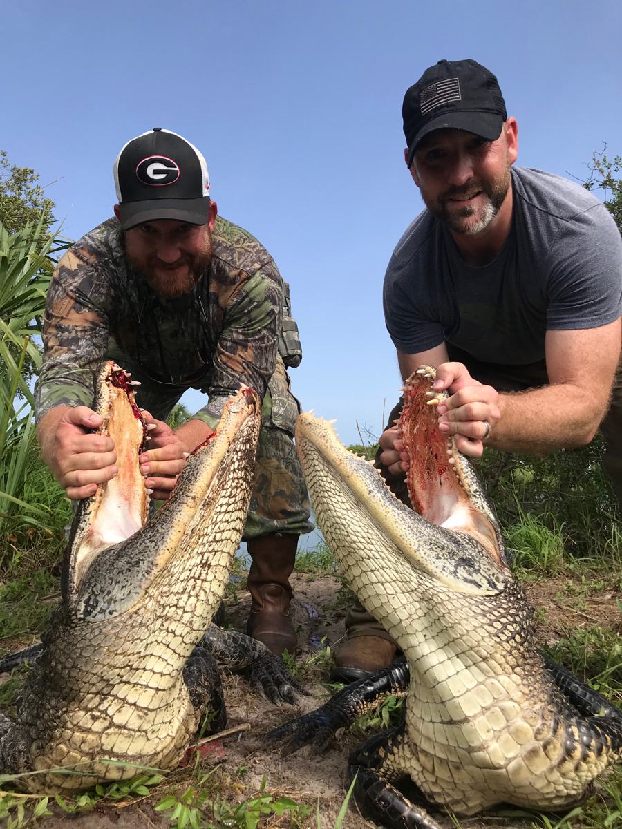 Hunter with a harvested alligator