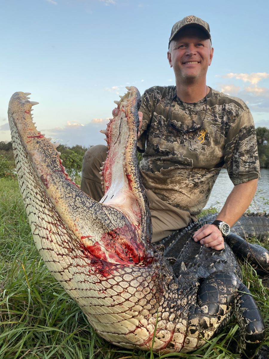 Hunter with a harvested alligator