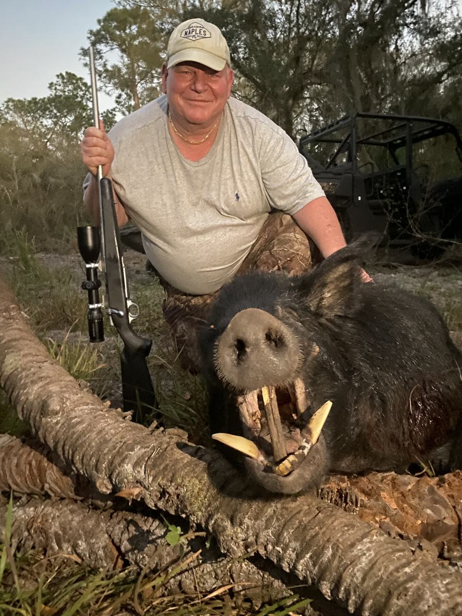 Hunter with a harvested alligator