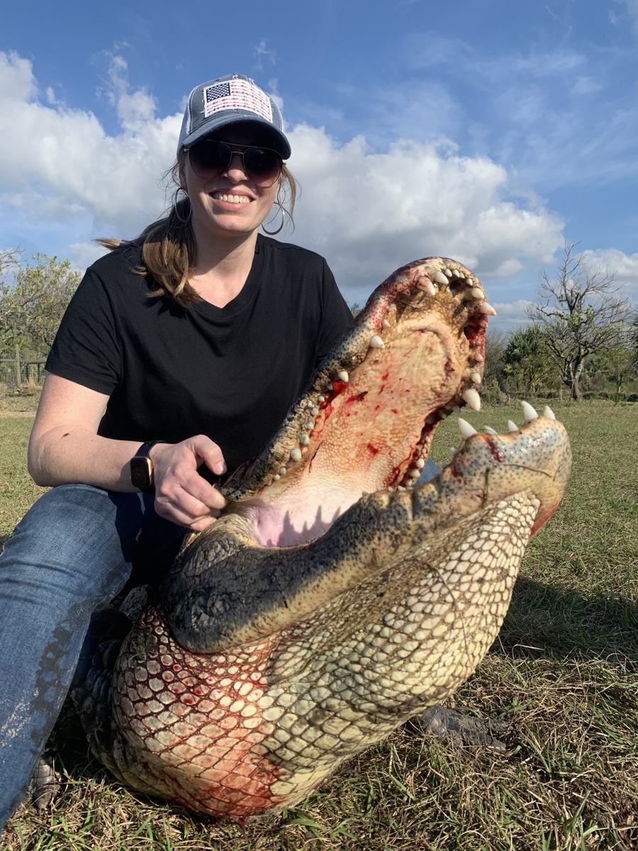 Hunter with a harvested alligator