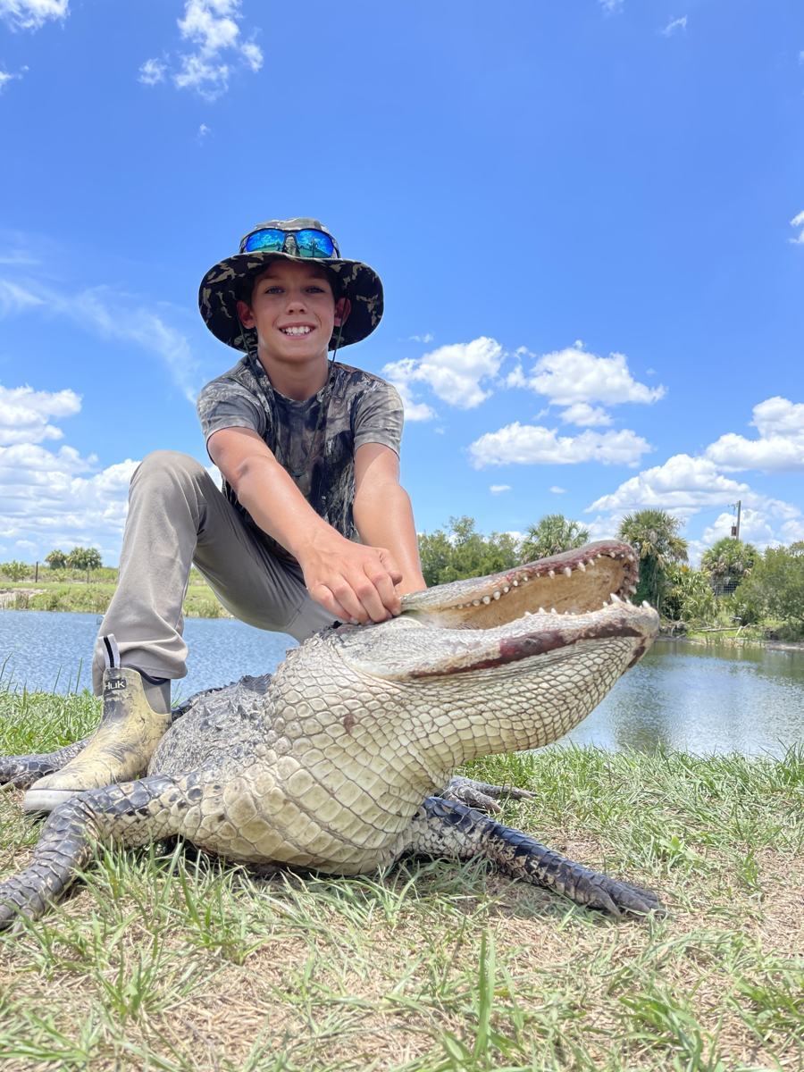 Hunter with a harvested alligator