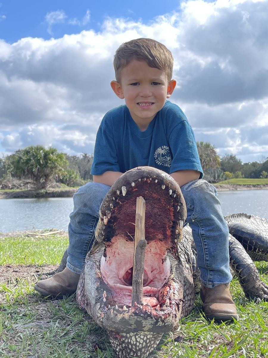 Hunter with a harvested alligator