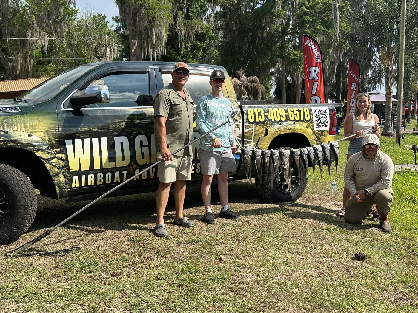 Wild Gator crew beside the wrapped truck