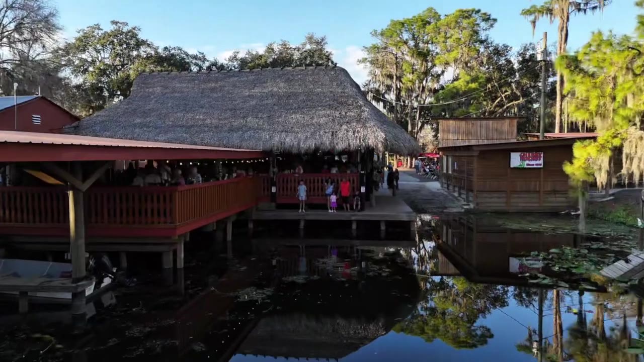 The thatched roof and red railings of Cherry Pocket, built out over the water