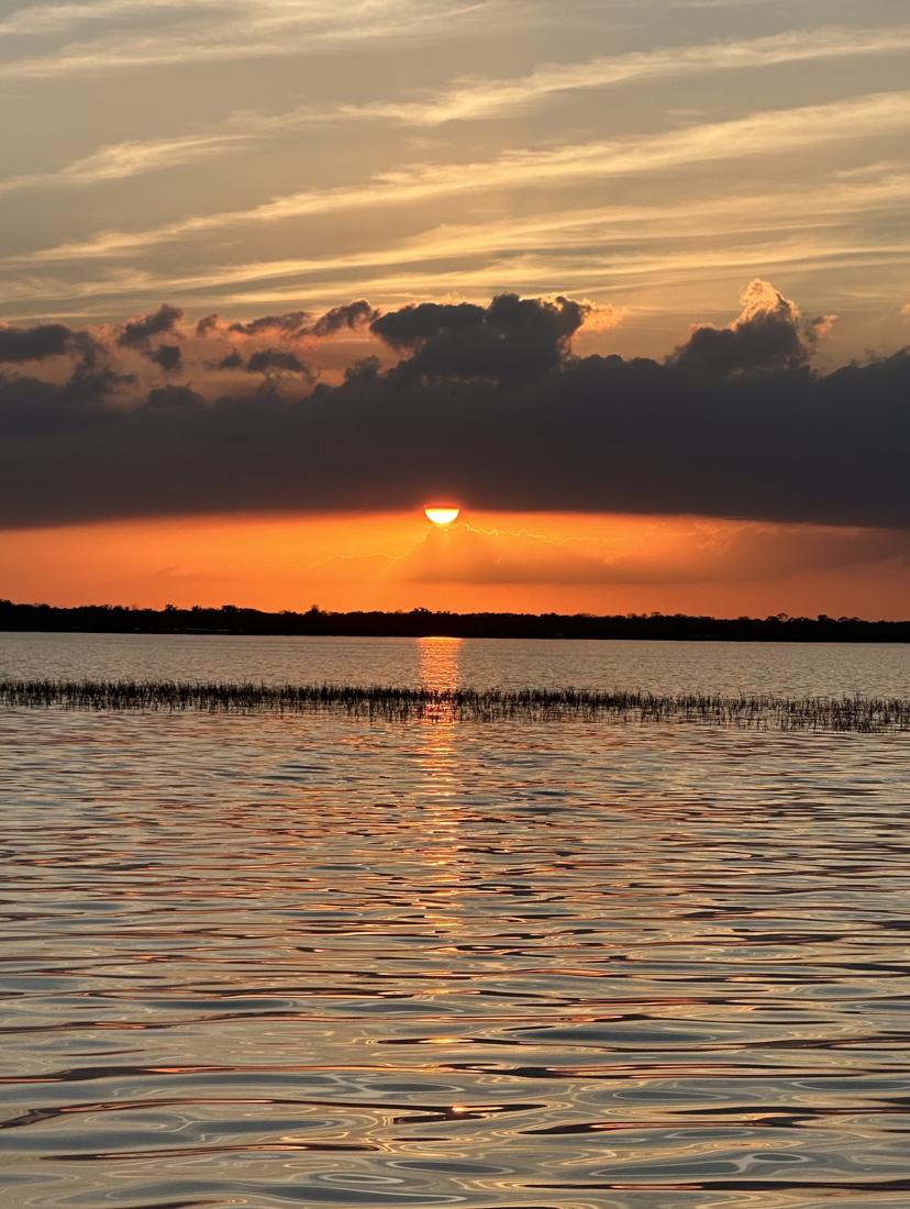 Orange sunset under a band of clouds