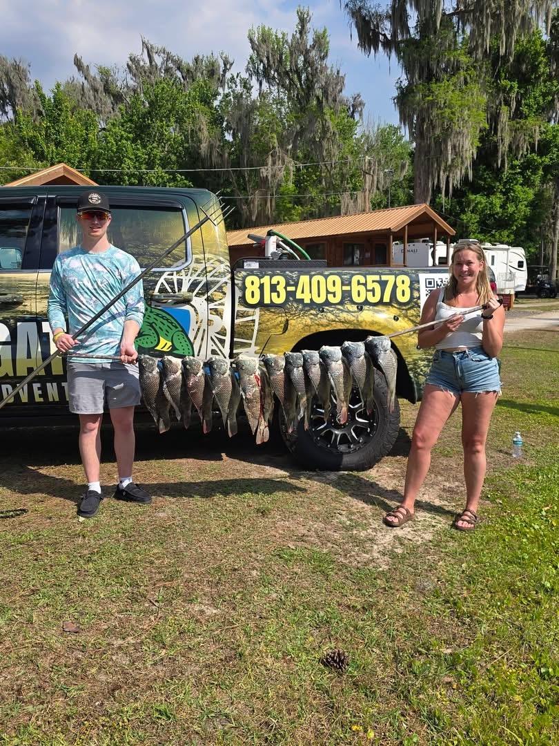 Two guests by the Wild Gator truck